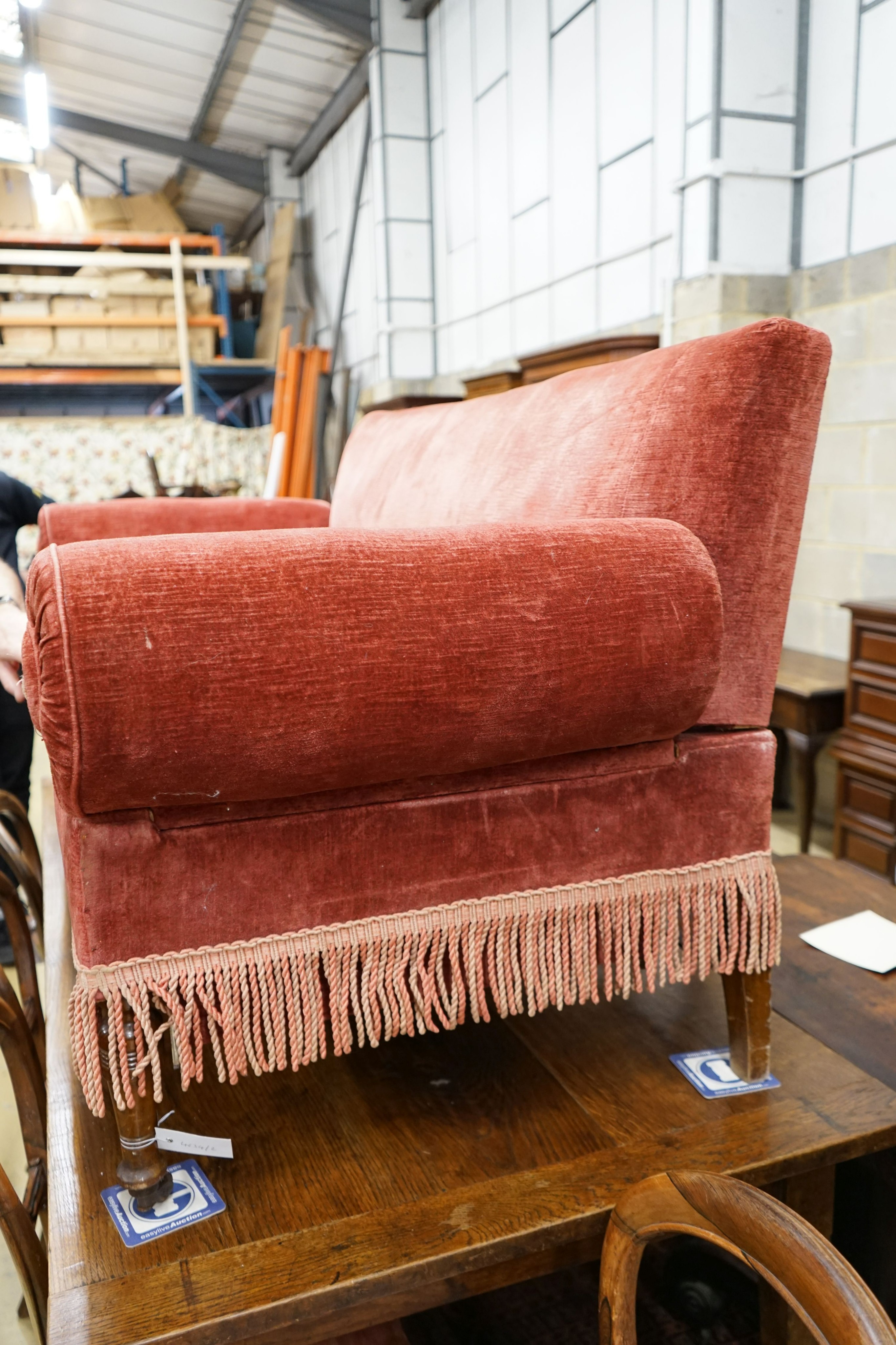 A 19th century Continental upholstered double drop arm settee, length 160cm, depth 74cm, height 84cm